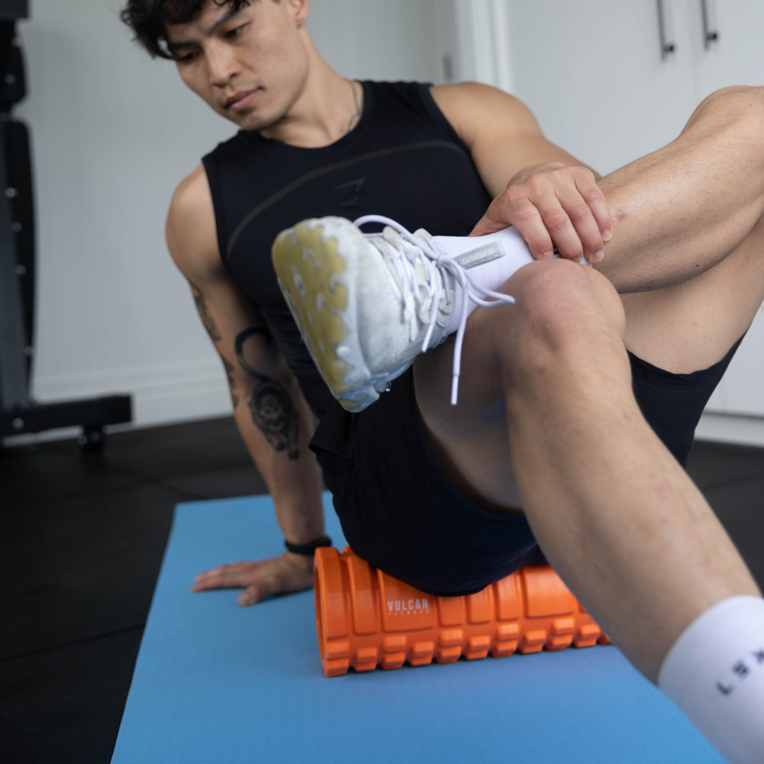 Man on orange foam roller